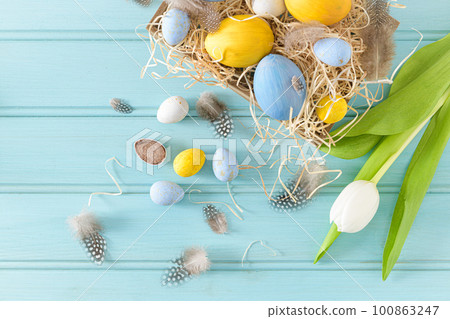 Easter background with blue and white eggs Easter background with blue and white eggs 100863247