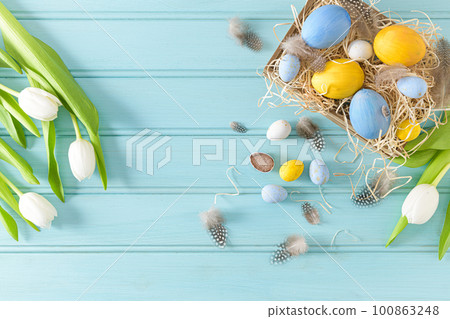 Easter background with blue and white eggs Easter background with blue and white eggs 100863248