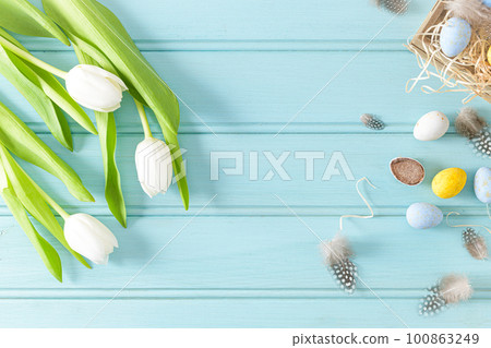 Easter background with blue and white eggs Easter background with blue and white eggs 100863249