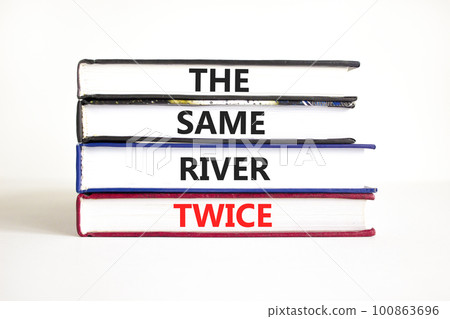 The same river twice symbol. Concept words The same river twice on books. Beautiful white table white background. Motivational business the same river twice concept. Copy space. 100863696