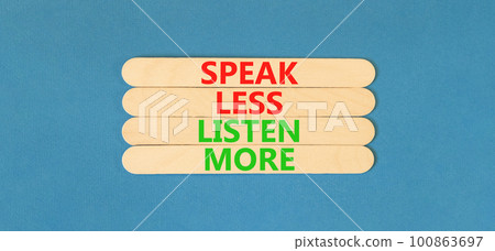 Speak less listen more symbol. Concept words Speak less listen more on wooden stick. Beautiful blue table blue background. Motivational business speak less listen more concept. Copy space. 100863697