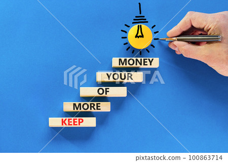 Keep more of your money symbol. Concept words Keep more of your money on wooden block. Beautiful blue table blue background. Businessman hand. Business keep more of your money concept. Copy space. Keep more of your money symbol. Concept words Keep more of your money on wooden block. Beautiful blue table blue background. Businessman hand. Business keep more of your money concept. Copy space. 100863714