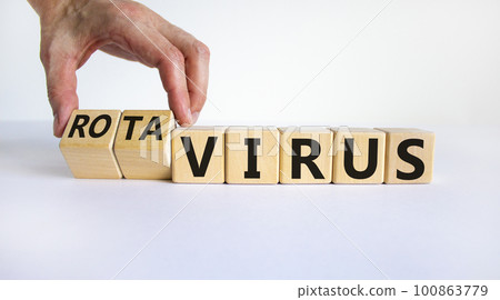 Virus or rotavirus symbol. Doctor turns cubes and changes the word 'virus' to 'rotavirus'. Beautiful white background. Medical, virus or rotavirus concept. Copy space. Virus or rotavirus symbol. Doctor turns cubes and changes the word 'virus' to 'rotavirus'. Beautiful white background. Medical, virus or rotavirus concept. Copy space. 100863779