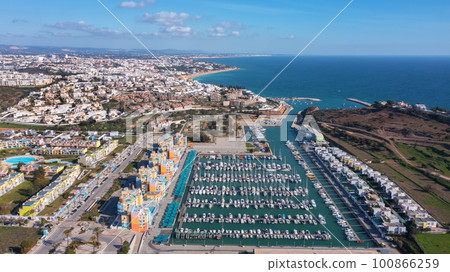 Aerial view portuguese fishing tourist town Albufuira with creative architecture. Portugal Algarve. front view Aerial view portuguese fishing tourist town Albufuira with creative architecture. Portugal Algarve. front view 100866259