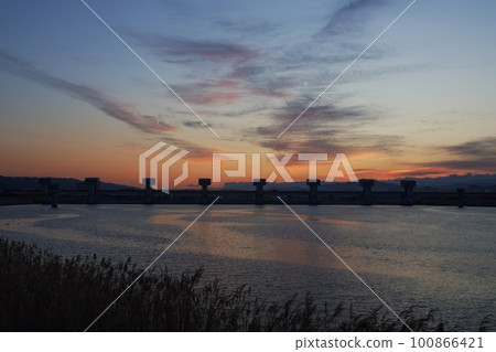 Colorful sunrise sky and reflected river・Spring・230301am 100866421