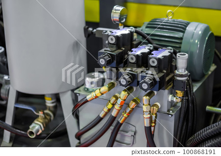 Part of automatic injection molding machine and plastic hoses at exhibition Part of automatic injection molding machine and plastic hoses at exhibition 100868191