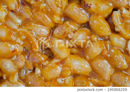 Caramelized nuts fried in honey - granola peanut bar - close up, top view 100868209