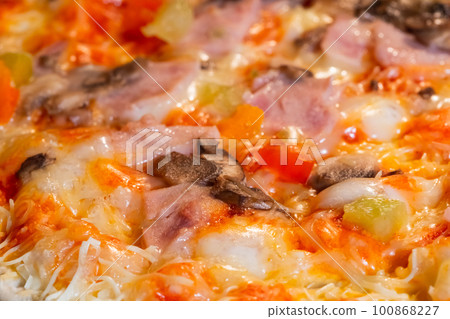 Baked homemade pizza in electric oven at home: close up, macro Baked homemade pizza in electric oven at home: close up, macro 100868227