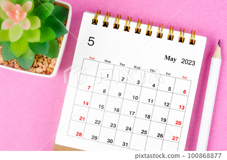 The May 2023 desk calendar for 2023 with plant pot on pink colour background. The May 2023 desk calendar for 2023 with plant pot on pink colour background. 100868877