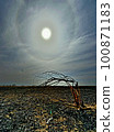 Sun halo on the late black earth 100871183