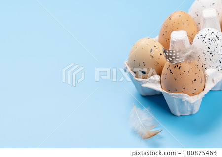 Eggs pack on a blue background 100875463