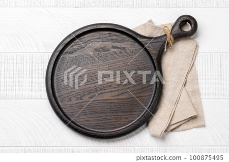 Wooden cutting board and kitchen towel Wooden cutting board and kitchen towel 100875495