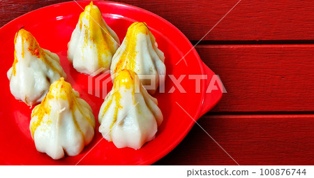 Modak for Ganesh Festival made from Milk and Sugar offered to God Ganesh during the festival season 100876744