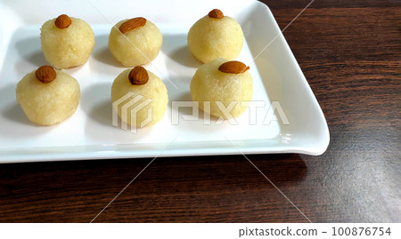 Coconut Sweet Laddo OR Nariyal Laddu a Popular Festival food from India. Selective focus Coconut Sweet Laddo OR Nariyal Laddu a Popular Festival food from India. Selective focus 100876754