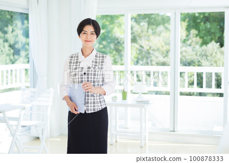 Portrait of a woman wearing a medical office uniform Portrait of a woman wearing a medical office uniform 100878333
