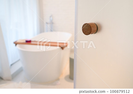 white bathroom with towels and bathtub white bathroom with towels and bathtub 100879512