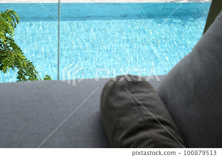gray pillow put on bed, pool view 100879513