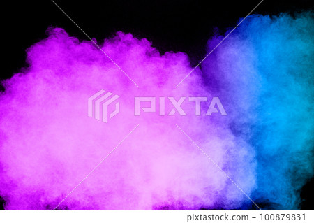 Launched blue pink dust particles splashing.Bizarre forms of blue pink powder explosion cloud on white background. 100879831