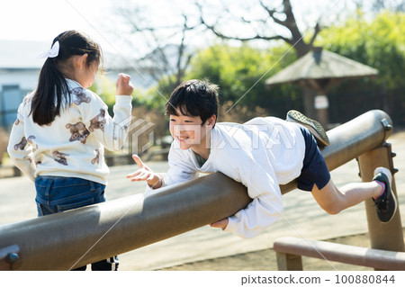 Kids playing happily in the park 100880844