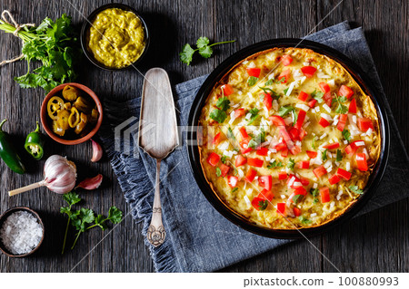 Green Chile Enchilada Casserole in baking dish Green Chile Enchilada Casserole in baking dish 100880993