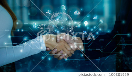 Business and Technology concept. Businessman and Businesswoman shake hands with digital and interface icon on blurred building background. Business and Technology concept. Businessman and Businesswoman shake hands with digital and interface icon on blurred building background. 100881939