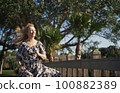 Happy retro styled woman running on the wooden bridge 100882389