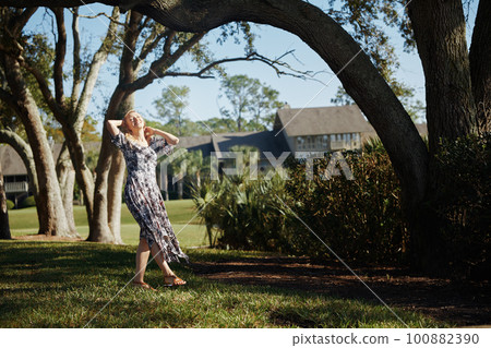 Retro styled woman having fun in the public park 100882390