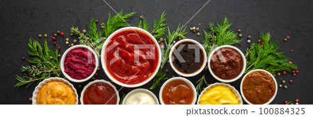 Sauces in bowls with seasonings 100884325