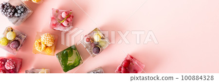Frozen ice cubes with various berries Frozen ice cubes with various berries 100884328