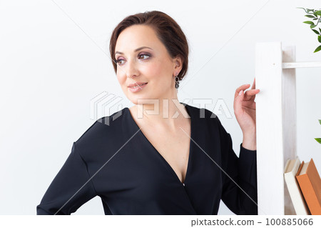 Young beautiful woman wearing elegant earrings posing indoors background. Beauty and fashion portrait. Jewellery and accessories concept 100885066