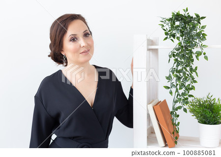 Glamour and beauty, jewelry and luxury concept - close up of beautiful woman face with stylish modern earring 100885081