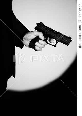 Pistol gun dark at night 100885678