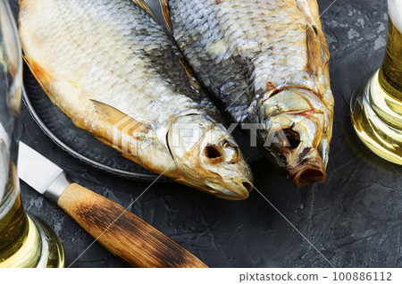 Dried salted fish for beer, stockfish 100886112