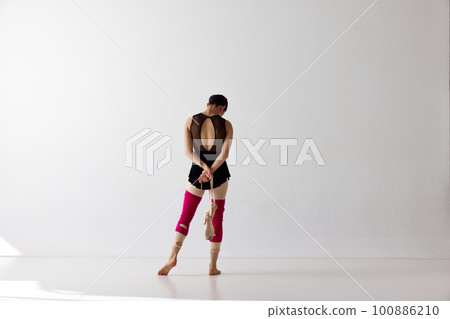 Back view. Graceful classical dance training over white background. Beauty and grace. Copy space for ad Back view. Graceful classical dance training over white background. Beauty and grace. Copy space for ad 100886210