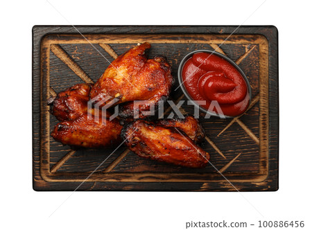 Barbecue chicken buffalo wings sauce on wood 100886456