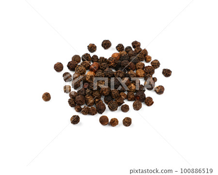 Heap of black peppercorns isolated 100886519