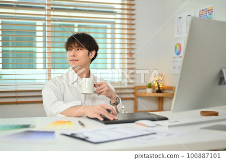 Thoughtful asian man web developer drinking coffee and looking through window, pondering idea in office Thoughtful asian man web developer drinking coffee and looking through window, pondering idea in office 100887101