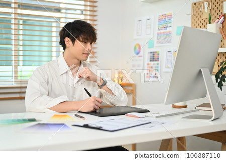 Handsome man web designer sketch planning application process development prototype wireframe for web mobile phone Handsome man web designer sketch planning application process development prototype wireframe for web mobile phone 100887110