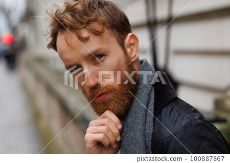 Street portrait of a thoughtful bearded man Street portrait of a thoughtful bearded man 100887867