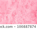 Trendy color of the year 2023. Surface of old shabby wall with falling off plaster, toned in viva magenta color as background or texture 100887874