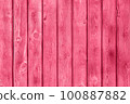 Trendy color of the year 2023. Wooden planks boards, vertical pattern, toned in viva magenta color as background or texture 100887882