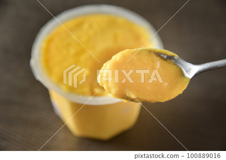 eat mango pudding with a spoon eat mango pudding with a spoon 100889016