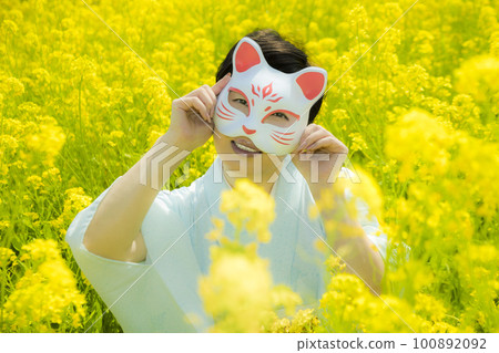 Japanese woman in a beautiful yellow flowers field Japanese woman in a beautiful yellow flowers field 100892092