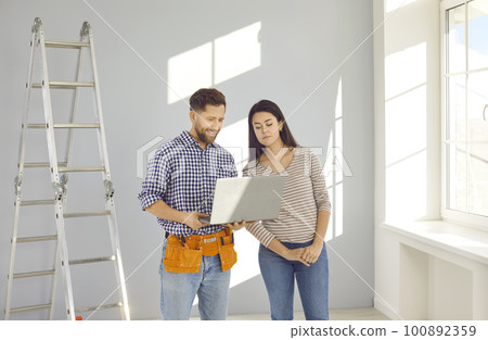 Young married couple is planning an apartment renovation and design project. 100892359
