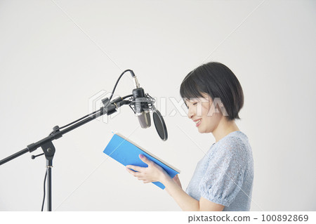 Female voice actor dubbing in the studio Female voice actor dubbing in the studio 100892869