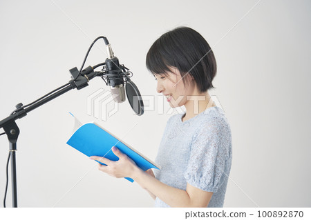 Female voice actor dubbing in the studio Female voice actor dubbing in the studio 100892870
