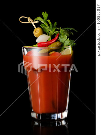 Vodka and tomato juice bloody mary cocktail in large glass on black. Vodka and tomato juice bloody mary cocktail in large glass on black. 100893017