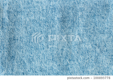 Denim structure, classic blue denim fabric, clear fabric structure, place for text. Background, texture. Selective focus, noise. 100893778