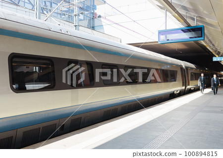 Fast modern passenger train on railway platform. Traveling concept background. Passenger transportation 100894815