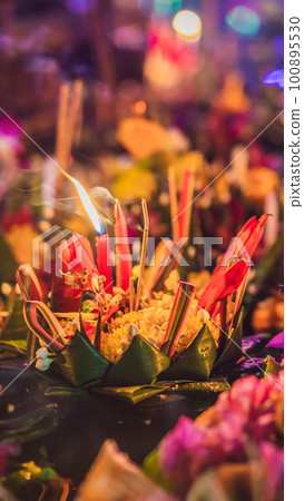 Loy Krathong festival, People buy flowers and candle to light and float on water to celebrate the Loy Krathong festival in Thailand 100895530